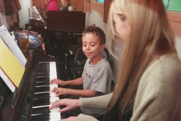 Rami wth his first piano teacher, age 6.
