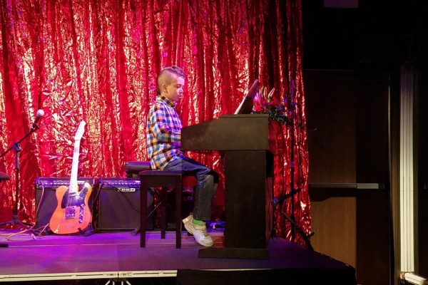 Rami performing at his piano recital, 2018